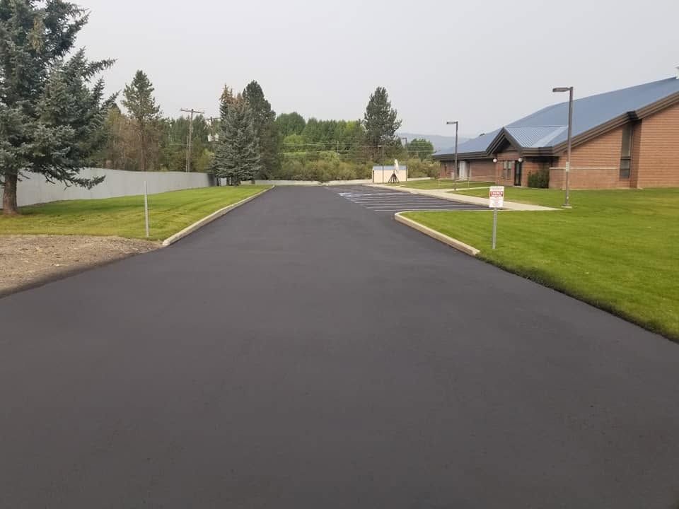 Freshly sealcoated commercial parking lot after A.A. Sealcoat completed the project