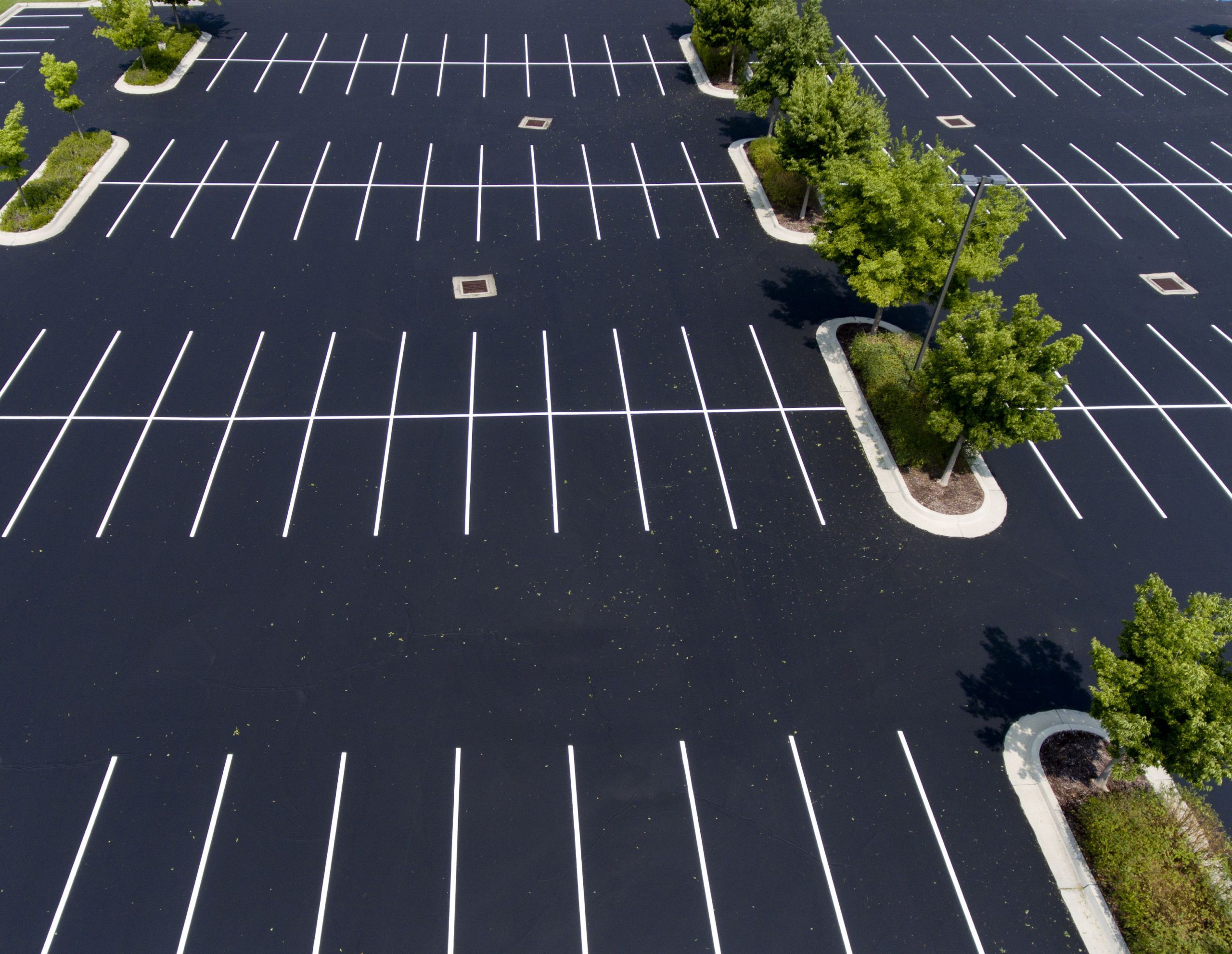 Freshly maintained commercial asphalt parking lot