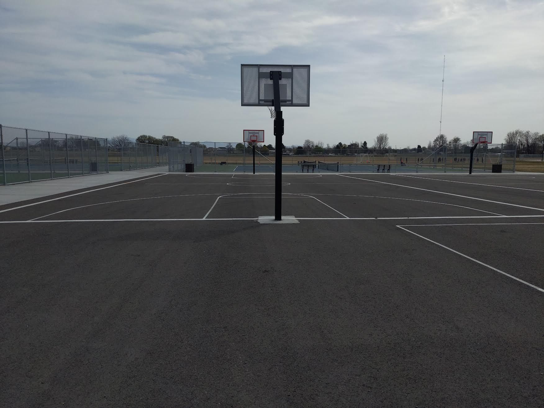 Worn basketball court area at Summitvue Middle School before maintenance