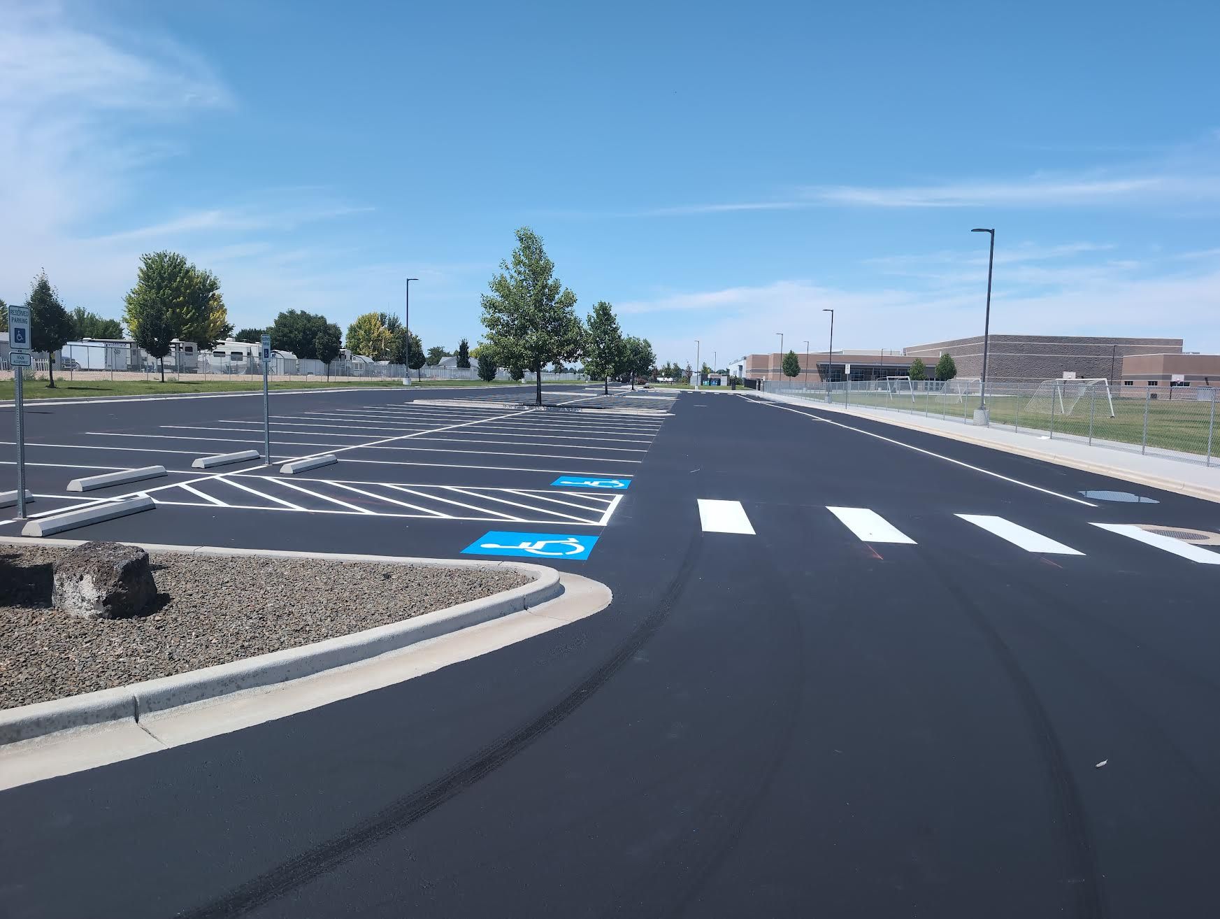 Freshly sealcoated and striped Summitvue Middle School parking lot completed by A.A. Sealcoat