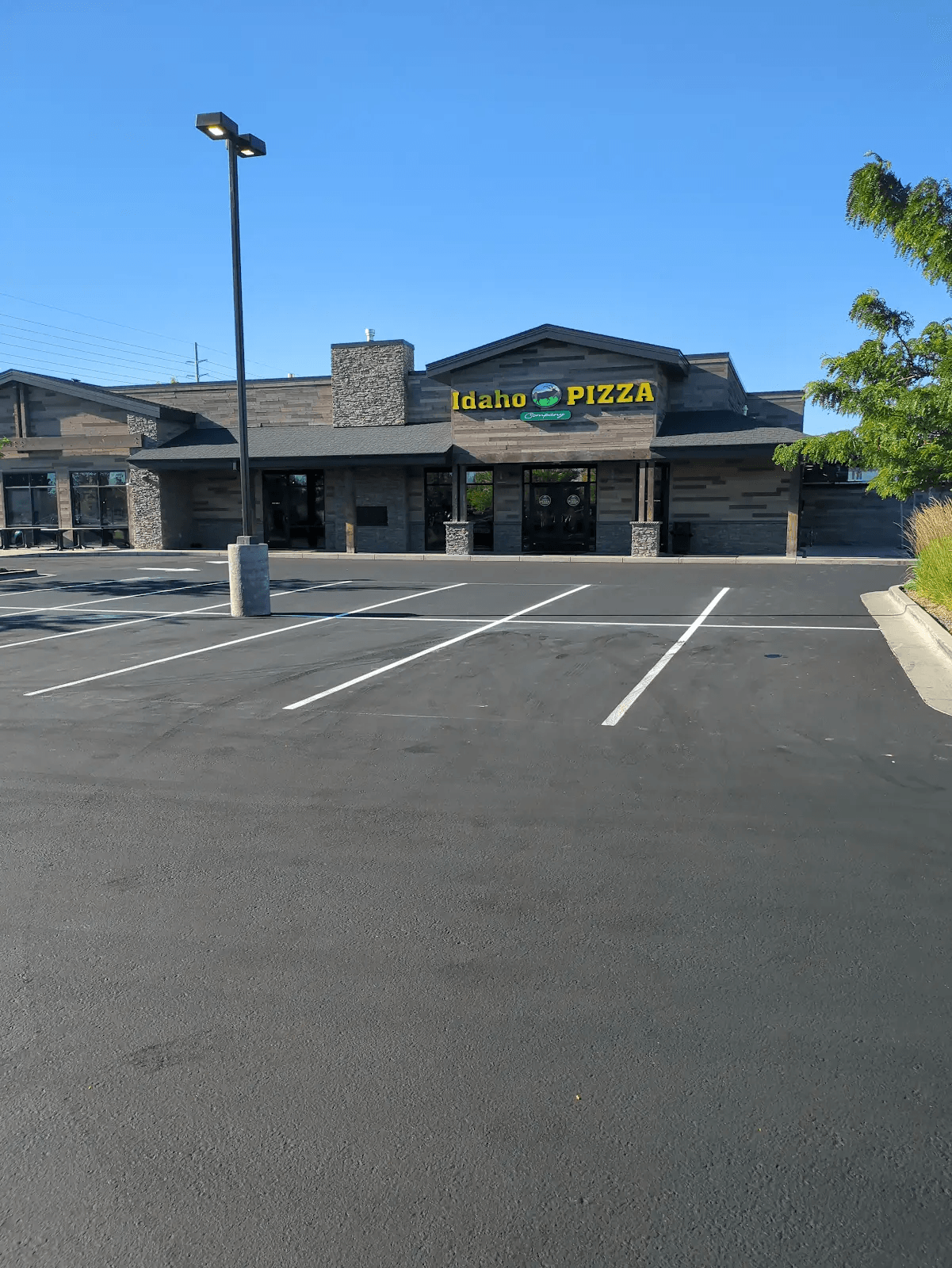 Freshly sealcoated and striped Idaho Pizza Company parking lot